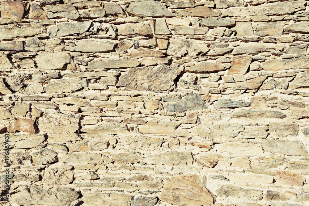 Fototapeta premium Warm Toned Ancient Stone Wall Masonry Texture
