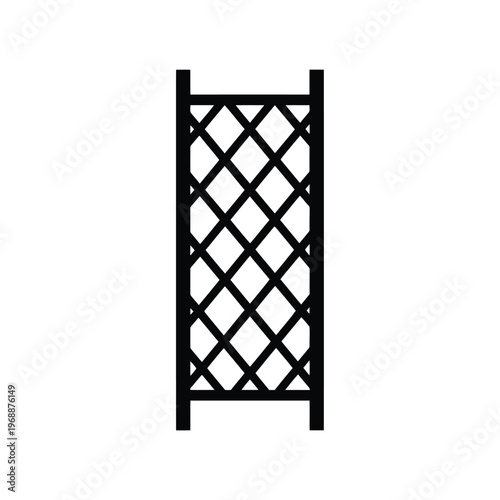 A black trellis stands alone in an outdoor garden environment with a decorative lattice structure.