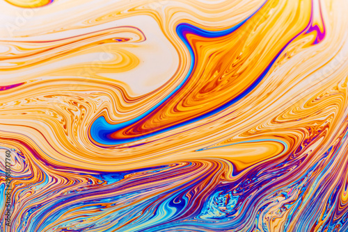 Close up on a soap bubble with random abstract forms and colors for background
