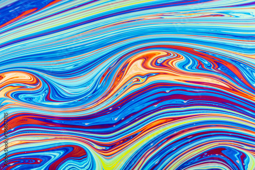 Close up on a soap bubble with random abstract forms and colors for background