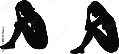 Black silhouette of a sad depressed woman sitting on floor with head in hands for mental health awareness loneliness and despair concept isolated on white.