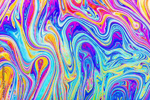Close up on a soap bubble with random abstract forms and colors for background