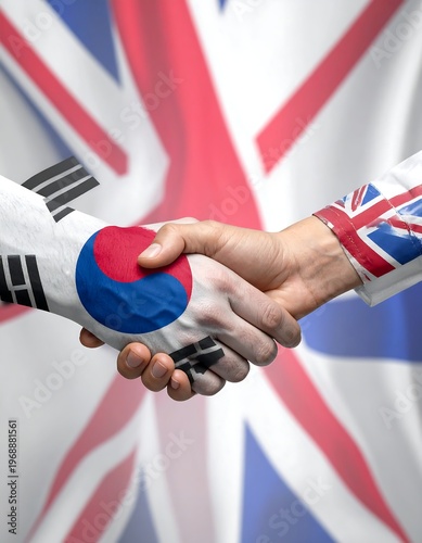 Two hands, painted with flags of nations, clasping in a handshake against a backdrop of flowing patriotic colors