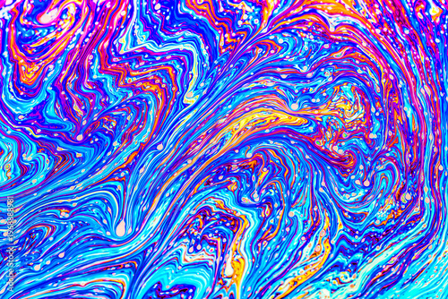 Close up on a soap bubble with random abstract forms and colors for background