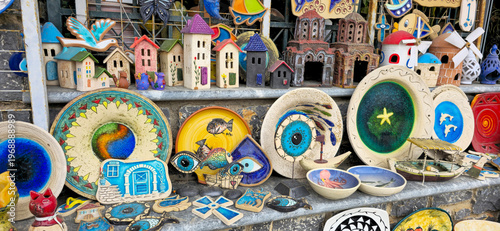 Obraz na płótnie Colorful handmade ceramic souvenirs displayed in a local gift shop on Chios Isla