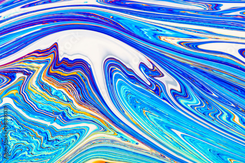 Close up on a soap bubble with random abstract forms and colors for background