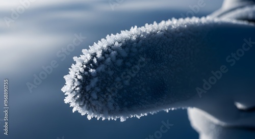 Close-up of frosty metal surface covered in snow and ice crystals on a cold winter day