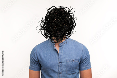 Frustrated man with nervous problem feel anxiety and confusion of thoughts. Mental disorder and chaos in consciousness. Indoor studio shot isolated on yellow background