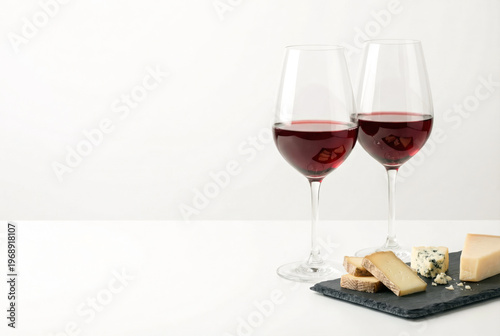 Red Wine and Cheese Pairing on Slate Board.