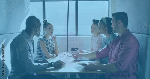 Animation of padlock icon over diverse business people having meeting at office