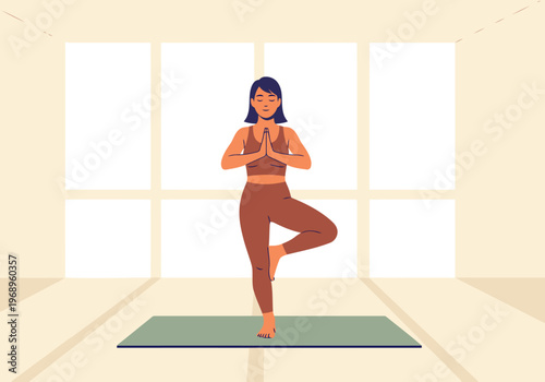 A serene woman practices tree pose in a bright, minimalist studio. She?s smiling, embodying wellness and balance. Focus on calm and mindful movement.