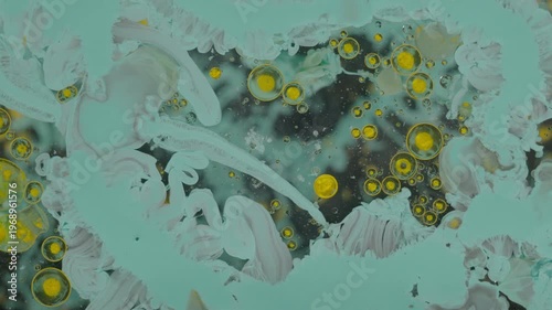 Yellow atoms and teal tendrils
