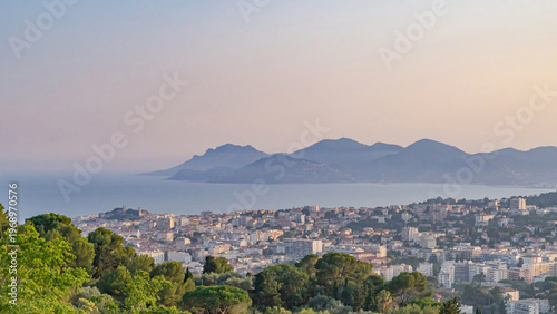 Panoramic view of Cannes and Esterel mountains at sunset, French Riviera.