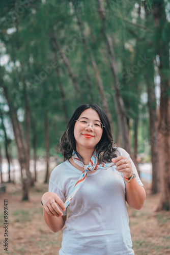 young gril Asian people enjoys a moment of relaxation in a sea  and nature. His happiness and self-love shine through as he embraces the peaceful outdoors.