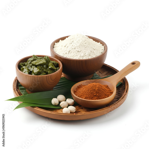 Wooden bowls filled with spices and ingredients for cooking.