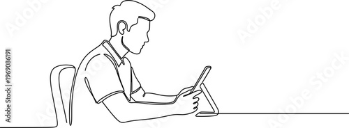 Man sitting at table with tablet.