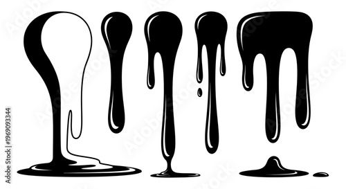 Black liquid drips on white background.