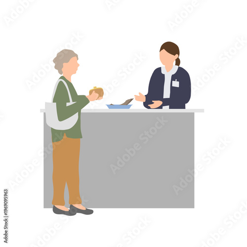 高齢者が受付で支払いをする会計シーン　医療機関の窓口対応