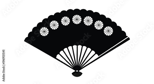 Traditional black and white decorative hand fan with circular motifs