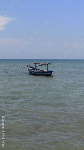 Wallpaper Mural A serene scene of fishing boats resting at the dock while the tide rises, with calm water surrounding the vessels and reflecting a quiet coastal atmosphere filled with daily maritime life. Torontodigital.ca