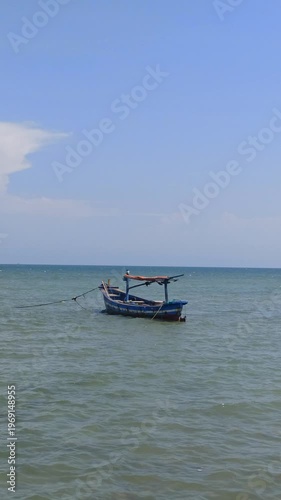 Wallpaper Mural A serene scene of fishing boats resting at the dock while the tide rises, with calm water surrounding the vessels and reflecting a quiet coastal atmosphere filled with daily maritime life. Torontodigital.ca