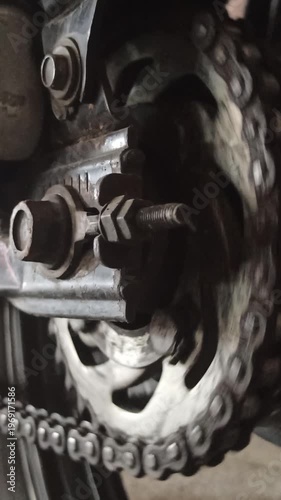 Wallpaper Mural A motorcycle chain on an underbone bike transfers engine power to the rear wheel, highlighting its function, durability, and role in smooth riding performance. Torontodigital.ca