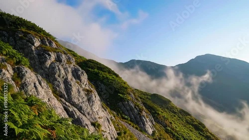 a quiet mountain slope with light haze and minimal cloud movement 