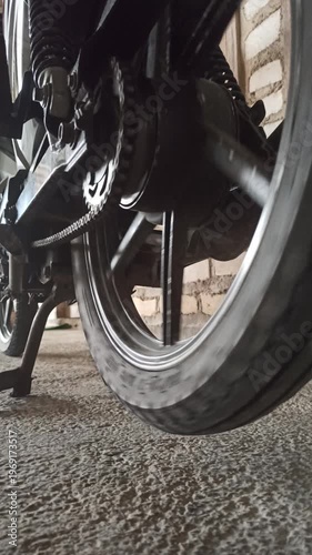 Wallpaper Mural A motorcycle chain on an underbone bike transfers engine power to the rear wheel, highlighting its function, durability, and role in smooth riding performance. Torontodigital.ca