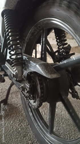 Wallpaper Mural A motorcycle chain on an underbone bike transfers engine power to the rear wheel, highlighting its function, durability, and role in smooth riding performance. Torontodigital.ca