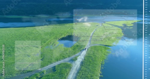 Aerial tracking marsh spit road, vehicle appearing triggers HUD showing pond and map marks for maps