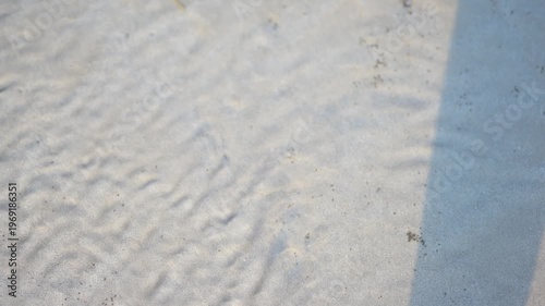 Clear water wave smoothing sandy bottom