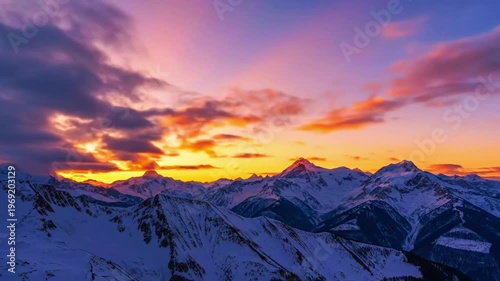 a mountain range at sunset with golden clouds drifting slowly, static camera