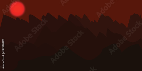 Dramatic sunset over jagged mountain range with glowing red sky and silhouette effect