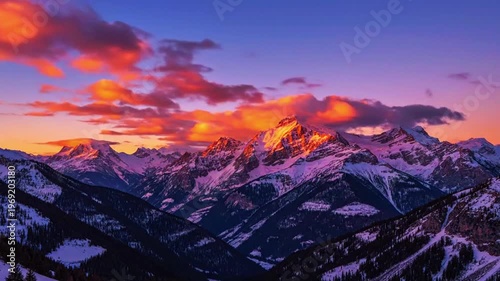  a distant mountain silhouette with glowing clouds drifting

