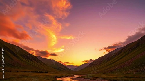 a mountain valley under orange sky with gentle cloud motion 