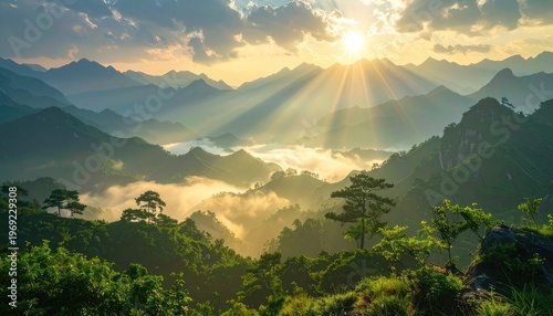 A breathtaking panoramic view of a mountainous landscape bathed in golden sunlight, with a sea of clouds nestled between the peaks, creating a serene and majestic scene.
