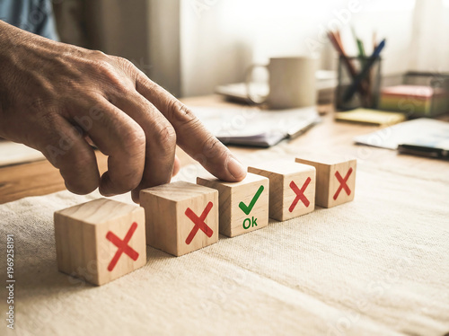 Hands arranging blocks marked with approval and disapproval symbols on a workspace., modern visual style, creative visual concept