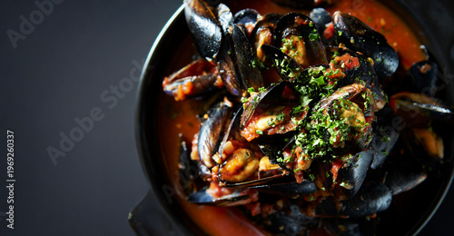 Bild auf Leinwand Tomato mussel soup in a pot