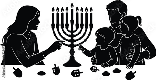 Family celebrating Hanukkah with menorah and traditional dreidels