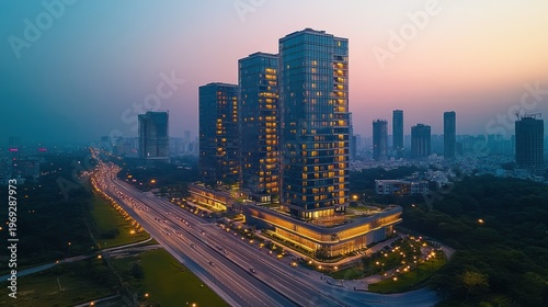 High-rise buildings at dusk over a city highway