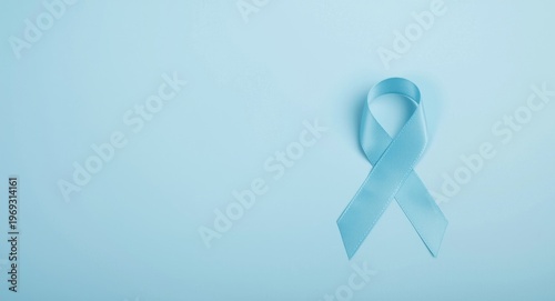 Mens health support concept with pale blue ribbon on tranquil blue background and copy space Free Download Mens health support concept with pale blue ribbon on tranquil blue background and copy space - GFXLoad