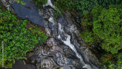 Obraz na płótnie Aerial view of Clear mountain stream running through a rocky riverbed, Nature la