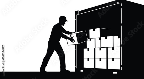 Silhouette of a worker loading boxes into a shipping container