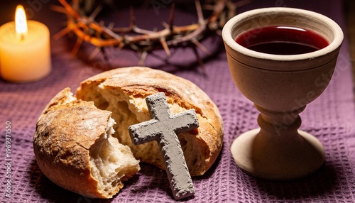 Still life of bread, silver cross, and wine cup on purple cloth with crown of thorns and candle in background, conveying a solemn and religious mood
