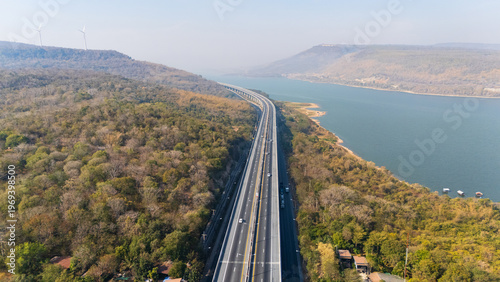 Drone shot aerial view landscape of the M6  motorway Expressway Nakhon Ratchasima Province - Bang Pa-in. Lam Ta Khong River and Mountain. Drone shot of scenic landscape rural place traffic