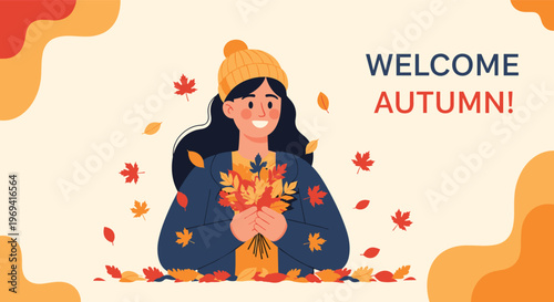 Cheerful woman wearing a winter hat holding a colorful bouquet of fallen autumn leaves to welcome the fall season transition.