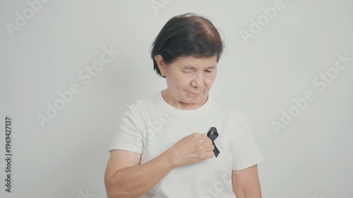 Elderly with Black ribbon for May Melanoma and skin cancer Awareness month, October Vaccine injury awareness month, Mourning Remembrance, March Sleep awareness week, Gang Prevention and Anti Violence
