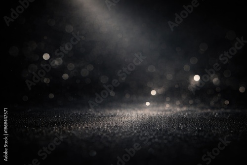 Black textured bokeh background with soft light ideal for editorial headers