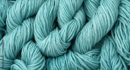 Soft turquoise knitting with bulky yarn strands