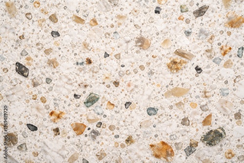 Intricate terrazzo stone texture background with white surface and unique speckled patterns